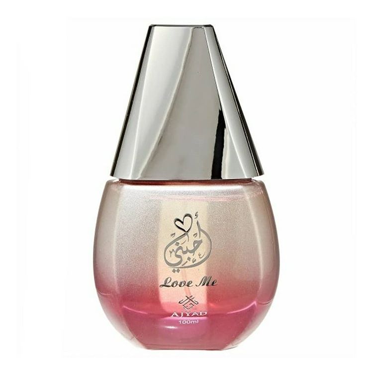 Ajyad Love Me perfume bottle with a pink gradient and silver conical cap.