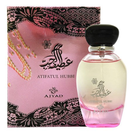 Atifatul Hubbi perfume by Ajyad: bottle with black cap next to its pink box with black lace pattern.