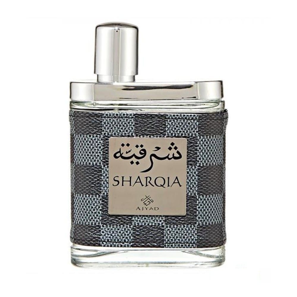 Sharqia perfume by Aiyad in a glass bottle with a grey checkered textured wrap and a silver label and cap.