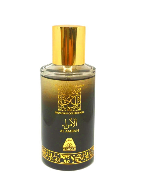 Anfar Al Amrah perfume bottle: cylindrical glass with dark liquid, a gold cap, and ornate gold lettering.