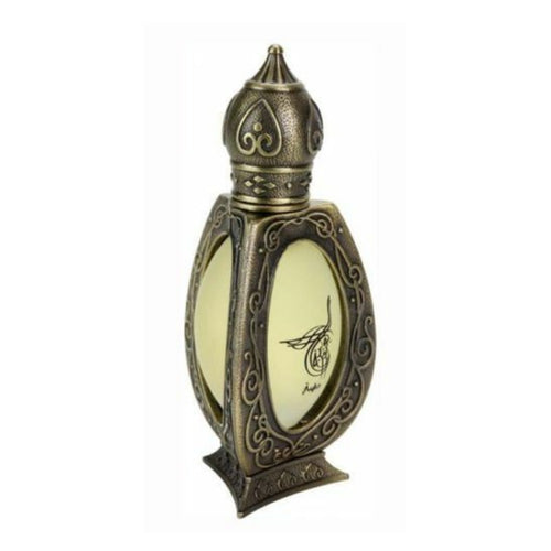 Ornate bronze perfume bottle with intricate filigree, frosted glass panels, and black Arabic calligraphy.
