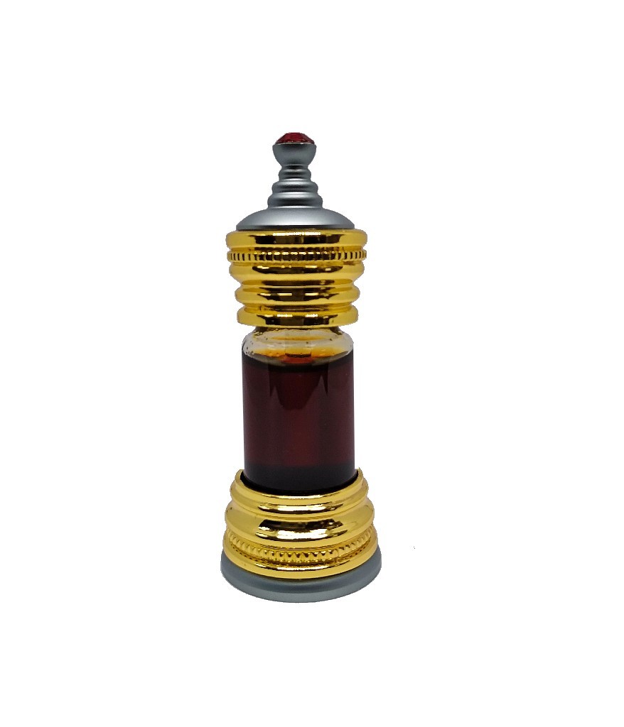 Ornate gold and silver Anfar perfume bottle containing dark brown perfume oil, topped with a small red jewel.