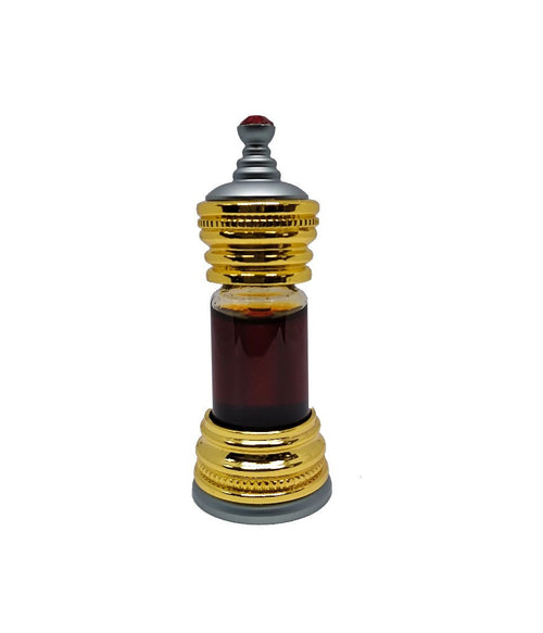 Ornate gold and silver Anfar perfume bottle containing dark brown perfume oil, topped with a small red jewel.