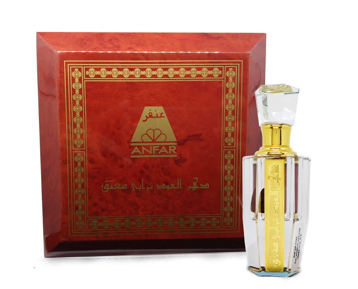 Anfar Dehn Al Oudh Turabi Moattaq perfume bottle and its ornate red-brown wooden presentation box.