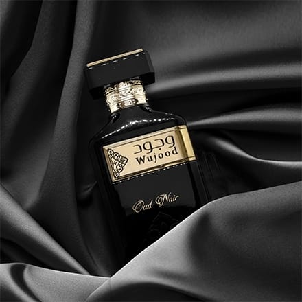 black oud perfume Close-up of Wujood Oud Noir by Adyan fragrance bottle with gold label