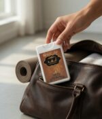 Placing Anaqat 20ml travel perfume bottle into handbag, slim pocket size perfume by Ard Al Oud