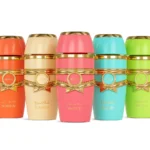 Five colorful Adyan perfume bottles: Surreal, Glamour, Majestic, Riviera, and Timeless with gold accents