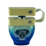Blue glass Ajyad Areej Al Shouq perfume bottle with a light-colored wooden block cap and side strap.