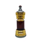 Ornate gold and silver Anfar perfume bottle containing dark brown perfume oil, topped with a small red jewel.